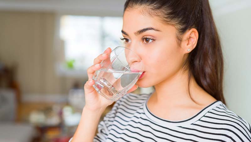 patient drinking more water following the advice of a Wilmington Chiropractor at Cowan Chiropractic & Rehabilitation