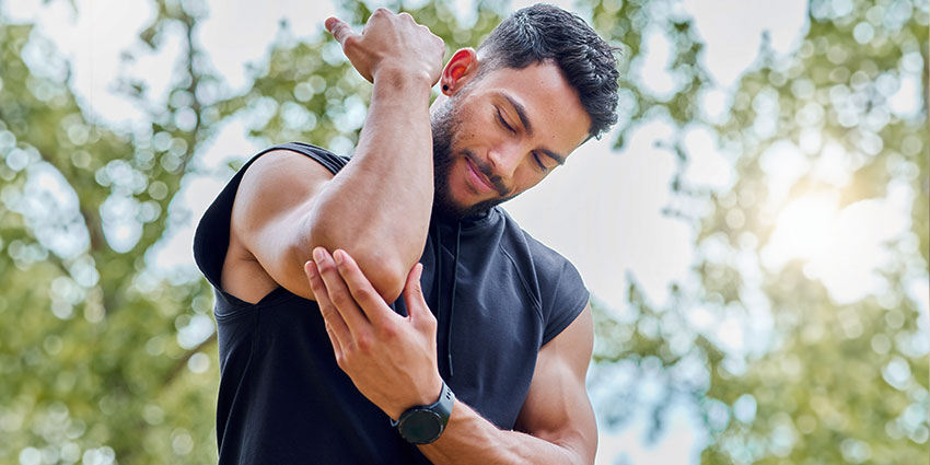 patient needing elbow pain chiropractor in Wilmington
